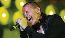  ??  ?? Linkin Park’s Chester Bennington (who died in 2017) performs in 2007. The band released a new version of “Hybrid Theory.”