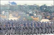  ?? REUTERS FILE ?? PLA personnel take part in a military parade.