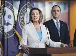  ?? J. Scott Applewhite Associated Press ?? REPS. NANCY PELOSI and Adam Schiff are shown together in 2021. He “knows well the nexus between a strong democracy and a strong economy,” Pelosi said.