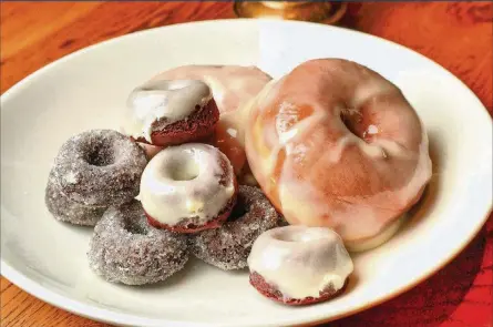  ?? STYLING BY CHRYSTA POULOS. CONTRIBUTE­D PHOTOS BY CHRIS HUNT ?? A trio of Chrysta Poulos’ shared doughnut recipes: chocolate-coffee doughnuts, fried yeast doughnuts and baked red velvet mini doughnuts.