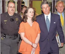  ?? THE OKLAHOMAN FILE ?? Brenda Andrew is escorted to the Oklahoma County jail in 2004. A federal appeals court upheld her murder conviction Tuesday.