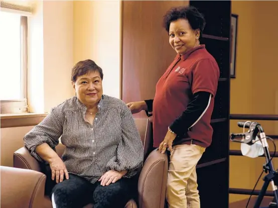  ?? BRIAN FRASER/THE NEW YORK TIMES ?? Felicia Biteranta, left, a retired nurse who has had limited mobility since she suffered a stroke, with her home health aide, Altagracia Garcia-Reyes, on March 11 in Jersey City, New Jersey.