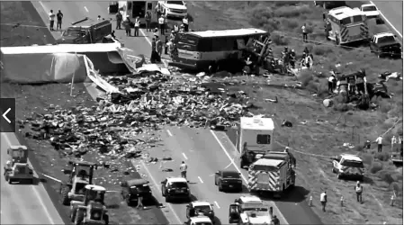  ?? KQRENEWS13 VIA AP ?? THIS PHOTO FROM VIDEO PROVIDED BY KQRENEWS13 SHOWS FIRST RESPONDERS WORKING THE SCENE of a deadly collision between a Greyhound passenger bus and a semi-truck on Interstate 40 near the town of Thoreau, N.M., near the Arizona border, on Thursday. Multiple people were killed and others were seriously injured. Officers and rescue workers were on scene but did not provide details about how many people were killed or injured, or what caused the crash.