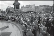  ?? AP/SANG TAN ?? Revelers gather Saturday at Trafalgar Square for a Santacon parade through the streets of London. The annual event features a mass gathering of sometimes-rowdy people dressed as Santa.