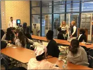  ?? PHOTOS BY RICHARD PAYERCHIN — THE MORNING JOURNAL ?? From right, Lorain High School teachers Christa Lokiec speaks and Regan Onweller looks on at the breakfast kickoff of oneLHS, a new club for students of all classes to focus on positivity and pride in their school and community. Lokiec and Onweller will serve as club advisers. Lorain High School Prinicipal Patrick Coleman is standing at left.