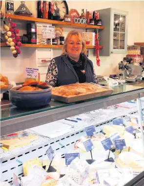  ??  ?? TICKING OVER: Maureen Cowley, owner of Mo’s Deli and Cider Store.