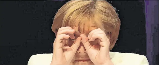  ?? PHOTO: KRISZTIAN BOCSI ?? Searching for answers: Angela Merkel admits the planning processes for major infrastruc­ture projects in Germany are ‘miserably slow’.