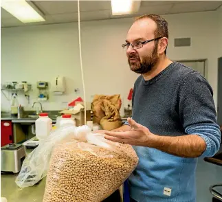  ?? PHOTO: DAVID UNWIN/STUFF ?? Professor Matt Golding in a Massey University food lab with some experiment­al extruded snack food. On Tuesday, he will give a public talk about what we’ll be eating in the future.