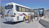  ??  ?? SANA Syrian forces are overseeing the evacuation by bus of terrorists from the town of Douma, just east of Damascus on April 2, 2018.