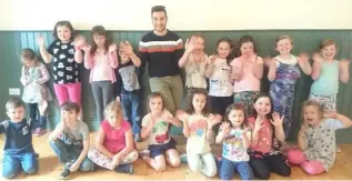  ??  ?? Rob Murphy with the children from From the Top theatre school summer camp.