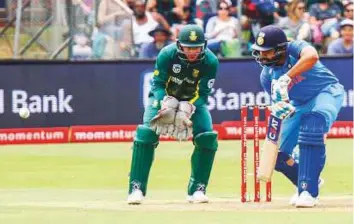  ?? AP ?? India’s Rohit Sharma plays a defensive shot during the fourth ODI against South Africa in Port Elizabeth on Tuesday. His 115 runs helped India clinch an ODI series for the first time in South Africa.