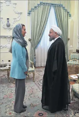  ?? / GETTY ?? Federica Mogherini y el presidente Hasan Rohani, en 2016.