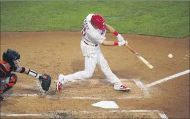  ?? MATT SLOCUM - THE ASSOCIATED PRESS ?? The Phillies’ Andrew Knapp hits an RBI double in the second inning Wednesday. Knapp tied a career high with three hits, but the Phillies fell to the Os, 5-4.