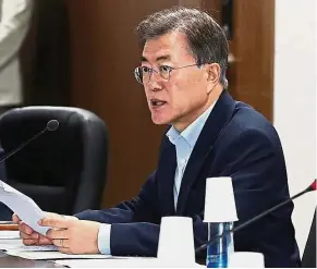  ??  ?? Key man: Moon presiding over the National Security Council at the Presidenti­al Blue House in Seoul recently. — Reuters