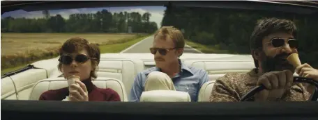  ??  ?? ROAD TRIP: Sophia Lillis, Paul Bettany and Peter Macdissi, from left, hit the road in ‘Uncle Frank.’