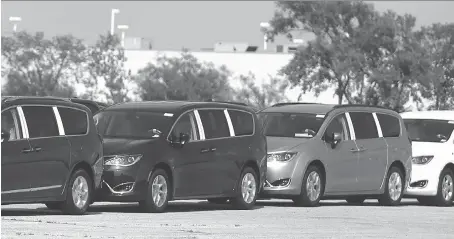  ?? JASON KRYK ?? Chrysler Pacificas are lined up in a holding lot near Provincial Road in Windsor on Thursday. The Windsor-built vehicles have won multiple awards in just their first year of production.