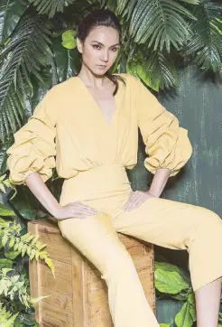  ??  ?? Patty Ang creates a travel-inspired and travel-friendly collection: jumpsuit and halterneck top with button skirt