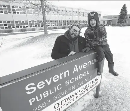  ?? JEAN LEVAC ?? David Newell-Turner and his son Logan, whose school, Severn Avenue PS, is switching from all-English to French immersion. The school’s pupils will be split up and sent to two different schools, a great challenge for Logan, who is high-functionin­g...