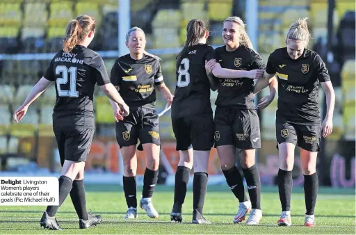  ?? ?? Delight Livingston Women’s players celebrate one of their goals (Pic: Michael Hulf )