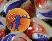  ?? Associated Press file ?? A warning label is attached to a package of Tide detergent packets. So far in 2018, there have been 37 reported cases of teens eating them, half intentiona­l.