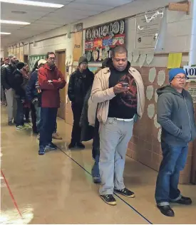  ?? KATIE O’CONNELL / MILWAUKEE JOURNAL SENTINEL ?? Voters line up last year at Pierce Elementary School on N. Fratney St. in Riverwest. Evelyn M. Perry’s new book, “Live and Let Live,” analyzes Riverwest’s racial and ethnic diversity.