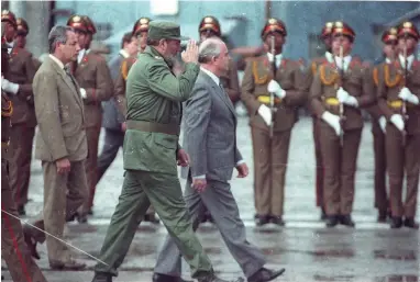 ?? (Reuters) ?? SOVIET LEADER Mikhail Gorbachev and Cuban President Fidel Castro review the troops during welcoming ceremonies at Jose Marti Airport in Havana, April 2, 1989.