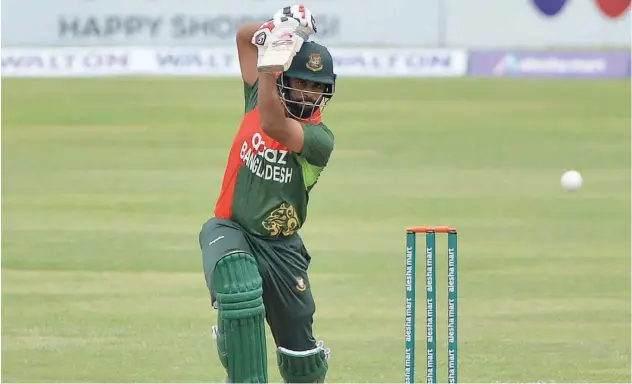  ?? Associated Press ?? ↑
Bangladesh batsman Tamim Iqbal plays a shot against Zimbabwe during their third ODI match .