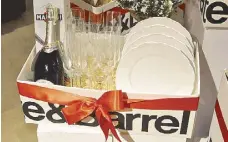  ??  ?? Christmas hamper worth P4,000 includes four Savannah salad plates, 10 Nattie sparkling wine glasses and a bottle of Astin Martini.