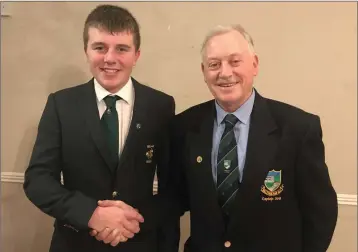  ??  ?? Baltinglas­s Golf Club member and Irish internatio­nal Joseph Byrne being congratula­ted for all his wonderful achievemen­ts during the year by Club Captain Martin Hennessy.