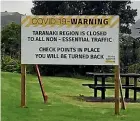  ??  ?? Signs telling non-essential travellers they will be turned away from Taranaki are still up in Mokau - the region’s northern border.