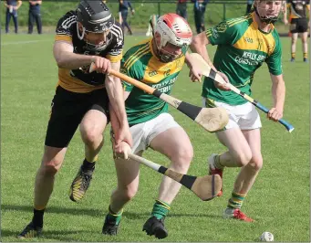  ??  ?? Ballygarre­tt’s Stephen Redmond puts pressure on HWH-Bunclody’s Conor Hendrick.