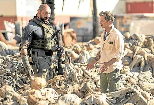  ?? —PHOTOS BY CLAY ENOS ?? Dave Bautista (left) with director Zack Snyder on the set of Netflix’s “Army of the Dead”