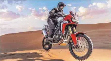  ?? FOTOS: DPA ?? Aufgefrisc­ht: die Africa Twin CRF1000L mit 95 PS von Honda.