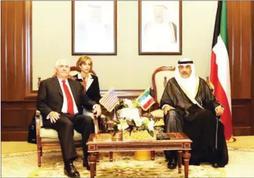  ?? KUNA/AFP ?? Kuwaiti Foreign Minister Sheikh Sabah al-Khaled al-Sabah (right) receives US Secretary of State Rex Tillerson (left) at the Foreign Ministry headquarte­rs in Kuwait City on Monday.