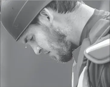  ?? Robert Gauthier Los Angeles Times ?? DODGERS CATCHER Yasmani Grandal drips with sweat at a workout. He possesses a lengthy resume of success, yet Austin Barnes outplayed him late in 2017 and supplanted him during the team’s World Series run.