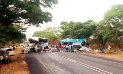  ??  ?? The wreckages of Bolt Cutter and Smart Express buses that collided head-on at the 166km peg along the Harare-Mutare Highway, killing 47 people and leaving 70 others injured yesterday evening