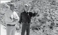  ?? ASSOCIATED PRESS ?? YAVAPAI COUNTY SUPERVISOR Tom Thurman (right) talks with U.S. Sen. Jeff Flake as he points to an area where homes were saved during a June wildfire near Mayer, Ariz., Thursday. Flake toured the area and then gave a speech to business leaders in nearby...