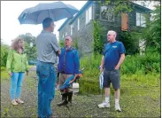  ?? SARAH GORDON/THE DAY ?? Members of the Norwich Harbor Management Commission, from left, Secretary Melinda Wilson, Michael Gualtieri, H. Tucker Braddock and Gerald Martin, tour the former Shetucket Iron & Metal scrapyard on Friday.