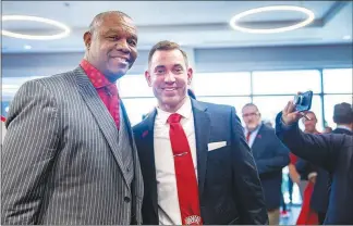  ?? STEVE MARCUS (2019) ?? Cunningham, left, poses with Marcus Arroyo at a December 2019 news conference at the Fertitta Football Complex at UNLV in which Arroyo was introduced as UNLV’S football coach. A quarterbac­k at UNLV, Cunningham went on play in the NFL for 16 seasons and is now team chaplain for the Las Vegas Raiders.