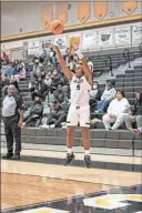  ?? Tim Godbee ?? Christophe­r Lewis shoots from outside the arch during the first half against Hiram. Hiram defeated the Jackets 62-48 in region 5A play Friday at Calhoun.