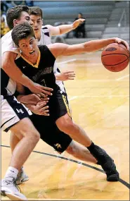  ?? MEDIANEWS GROUP FILE PHOTO ?? Collin Gillespie (Archbishop Wood) makes a hard turn into Jackson Danzig (Abington Heights) March 21, 2017.