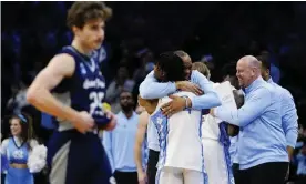  ?? Photograph: Chris Szagola/AP ?? North Carolina's Hubert Davis and Caleb Love celebrate after their victory over St Peter’s.