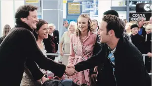  ?? ASSOCIATED PRESS ?? Colin Firth, Lucia Moniz, Keira Knightly and Andrew Lincoln appear in a scene at an airport, in “Love Actually.”