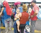  ?? AFP/GETTY IMAGES ?? Immigrants line up hoping for admission to the United States.