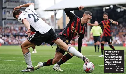  ?? RICHARD HEATHCOTE/GETTY IMAGES ?? Phil Foden of Manchester City battles for possession with Joao Palhinha of Fulham
