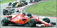  ?? FAN JUN / XINHUA ?? Above: Ferrari driver Sebastian Vettel of Germany (front) competes in the Chinese Grand Prix at the Shanghai Internatio­nal Circuit on April 9.