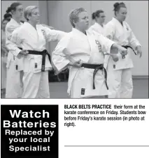  ??  ?? BLACK BELTS PRACTICE their form at the karate conference on Friday. Students bow before Friday’s karate session (in photo at right).