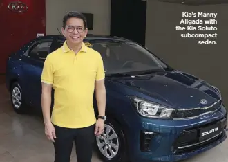  ??  ?? Kia’s Manny Aligada with the Kia Soluto subcompact sedan.