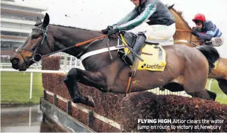  ??  ?? FLYING HIGH Altior clears the water jump en route to victory at Newbury