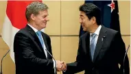  ?? PHOTO: REUTERS ?? Bill English meets his Japanese counterpar­t, Shinzo Abe in Tokyo last week.